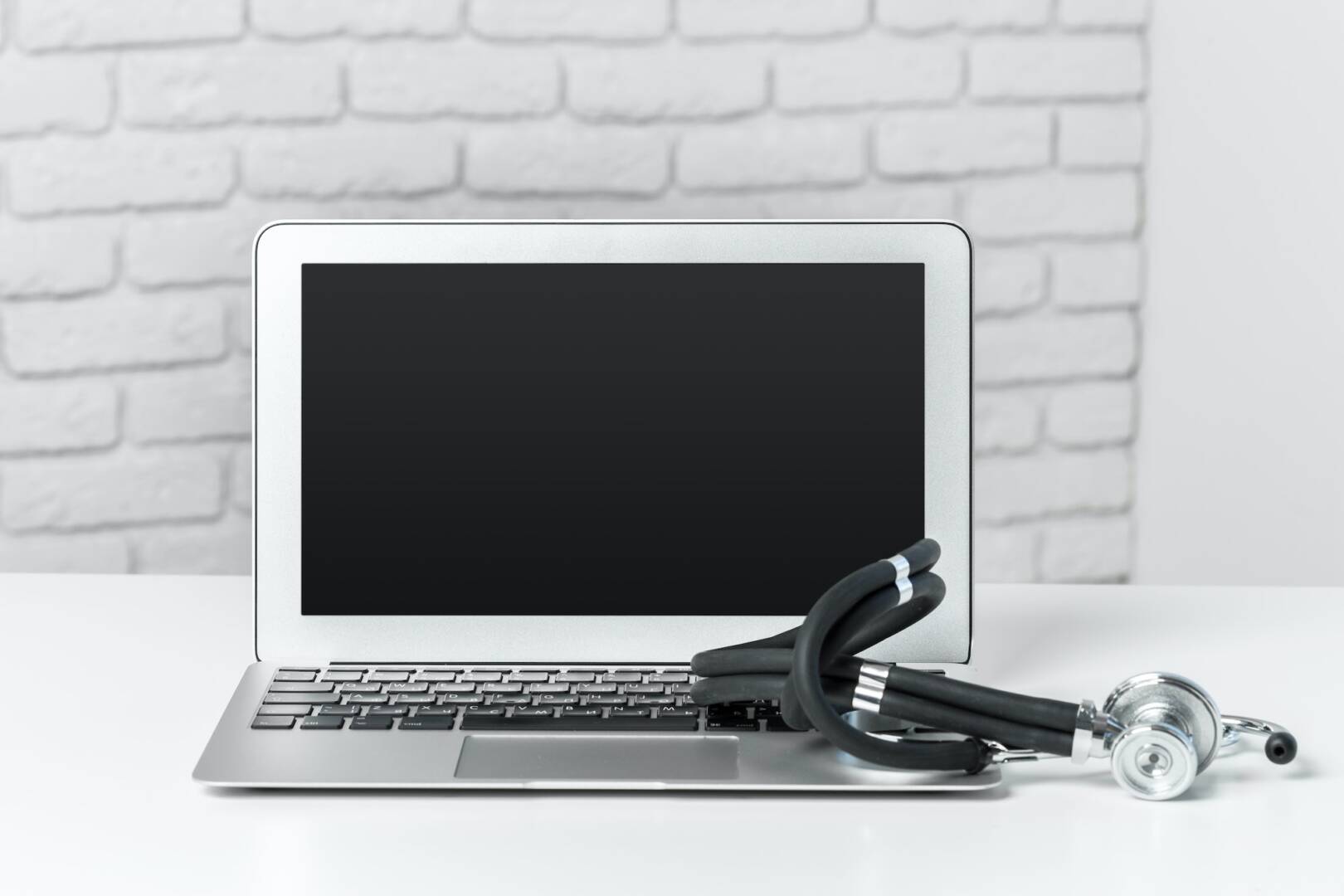 stethoscope on modern laptop computer. Healthcare concept